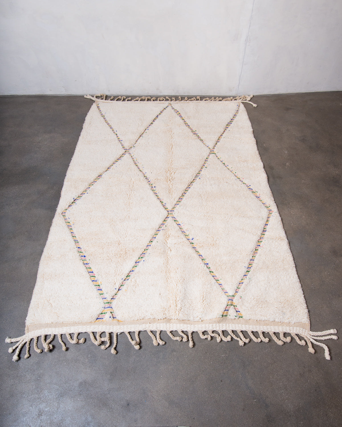 Modern, designer, handcrafted Berber rug from Morocco. Beniourain carpet with beautiful colours and patterns and fluffy wool texture.
